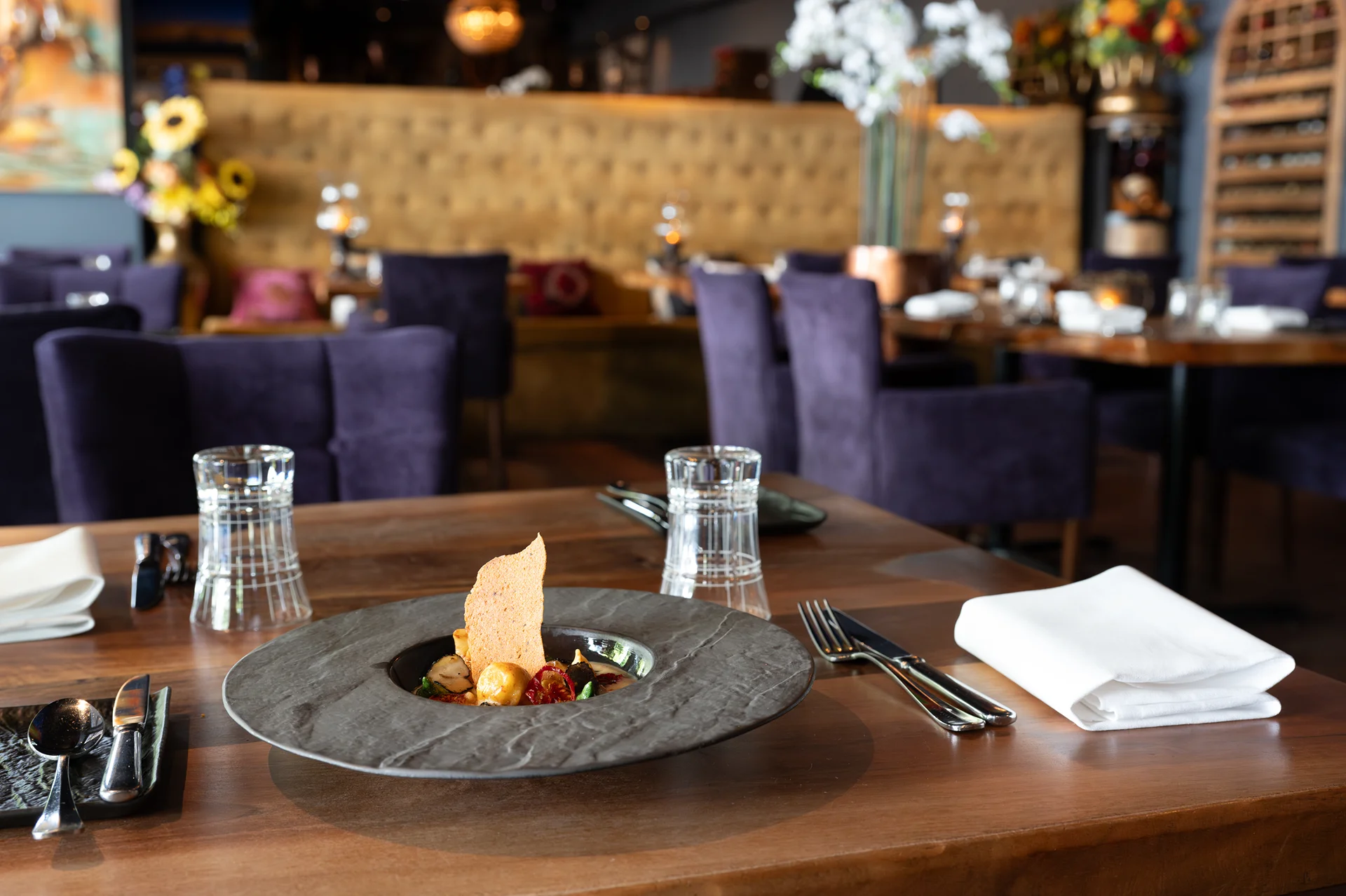 Small plated course on a dining table